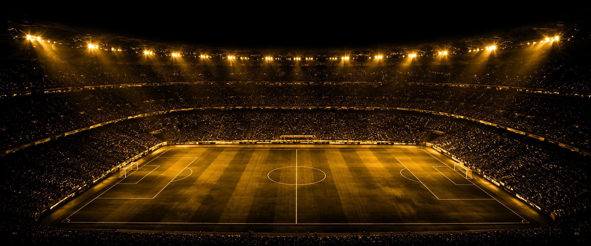 A floodlit World Cup stadium packed under the lights